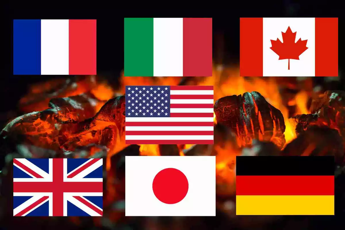 Un fotomuntatge de carbó cremant amb les banderes del G7