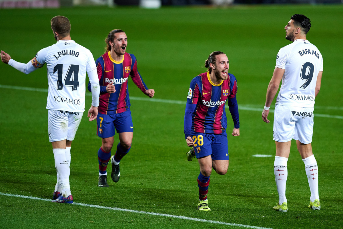 15 March 2021, Spain, Barcelona: Barcelona's Oscar Mingueza celebrates scoring his side's third goal during the Spanish Primera Division soccer match between FC Barcelona and SD Huesca at Camp Nou sta