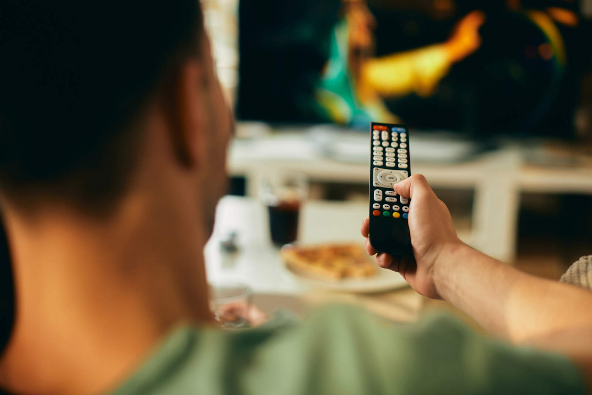 Closeup man watching tv home 1600 1067