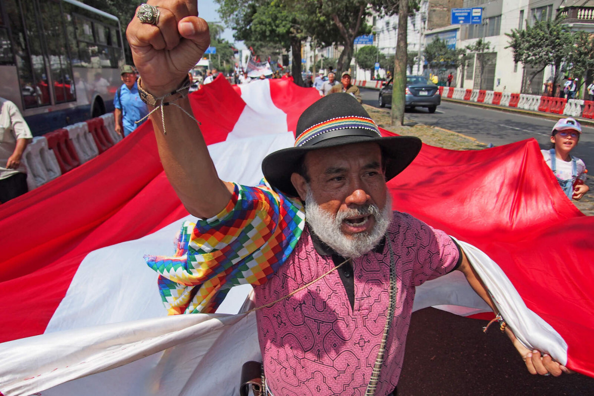 Europapress 6047287 may 2024 lima lima peru elderly indigenous man pulling giant peruvian flag 1600 1067